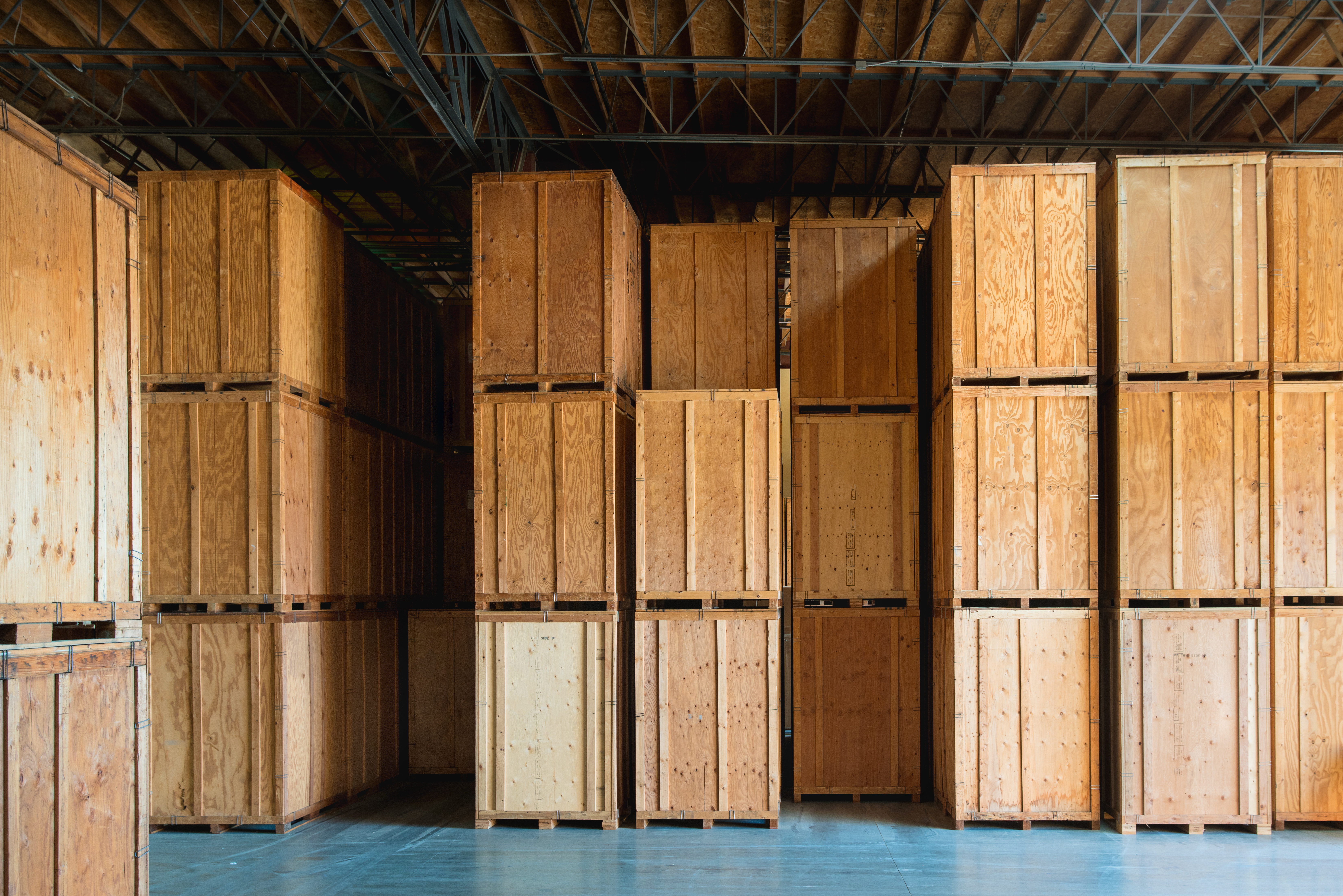Clean Storage Warehouse with Custom Crates. Storage solutions with crates made of wood interior. Logistics and Distribution